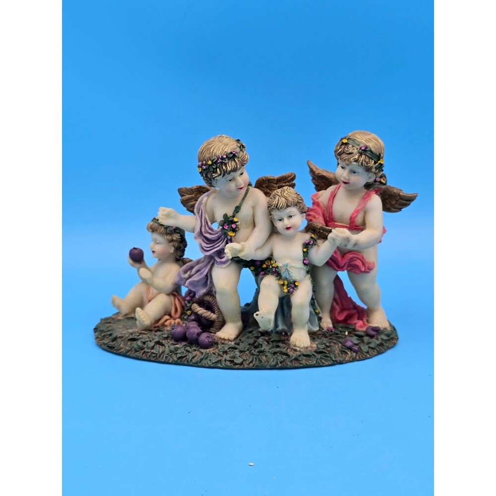 Angel Family Figurines On Garden Fruit Basket Approx H 4.5” L 6” W 2.5”